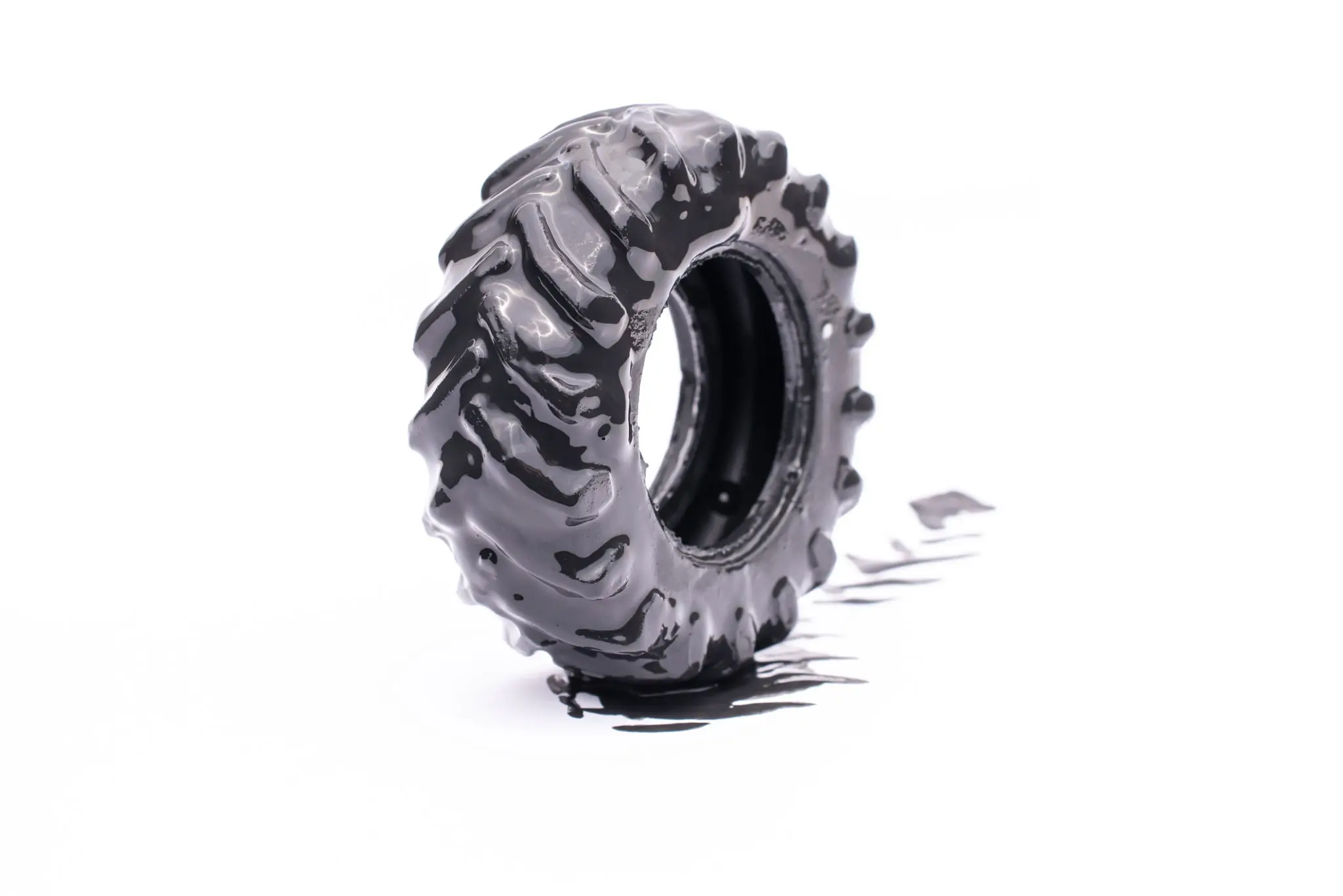 Tractor tire covered in black paint